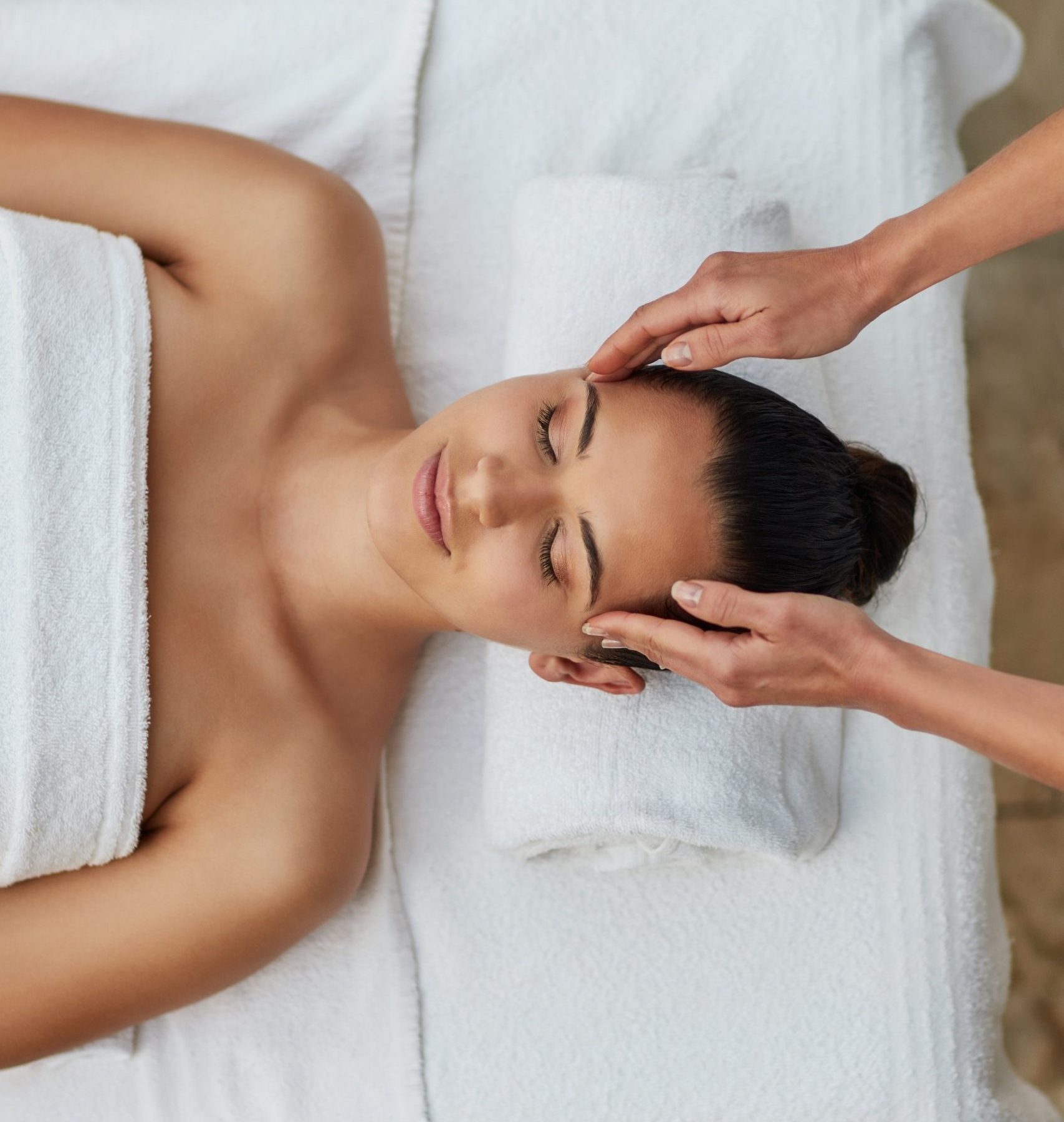 Release what stresses you out Cropped shot of a beautiful young woman enjoying a head massage at the spa